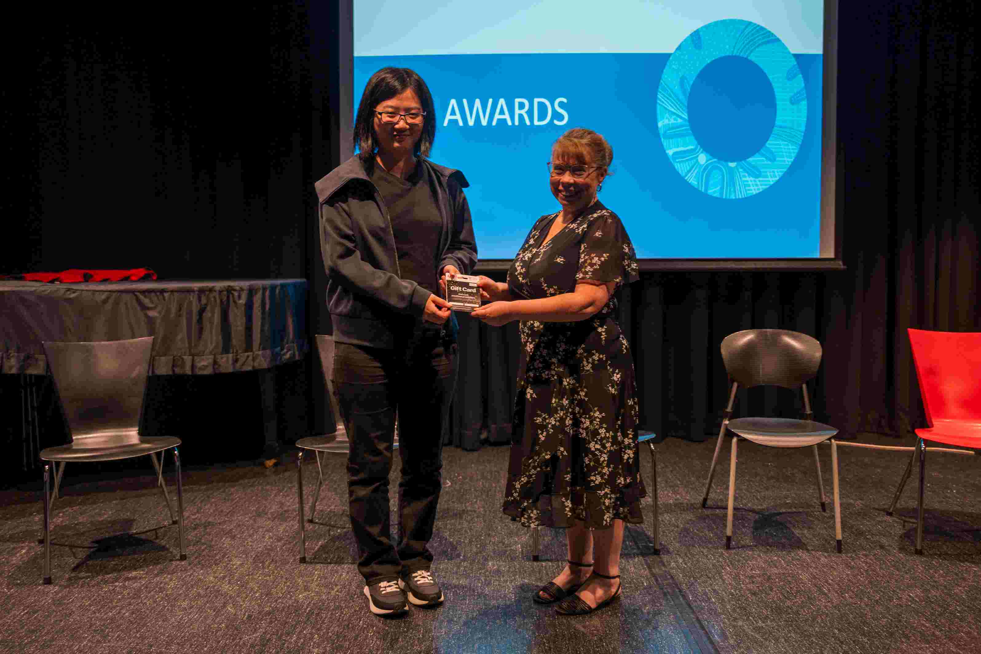 A person receiving an award on stage.