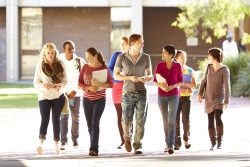 international students walking on campus grounds