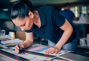 A student looking at colour prints
